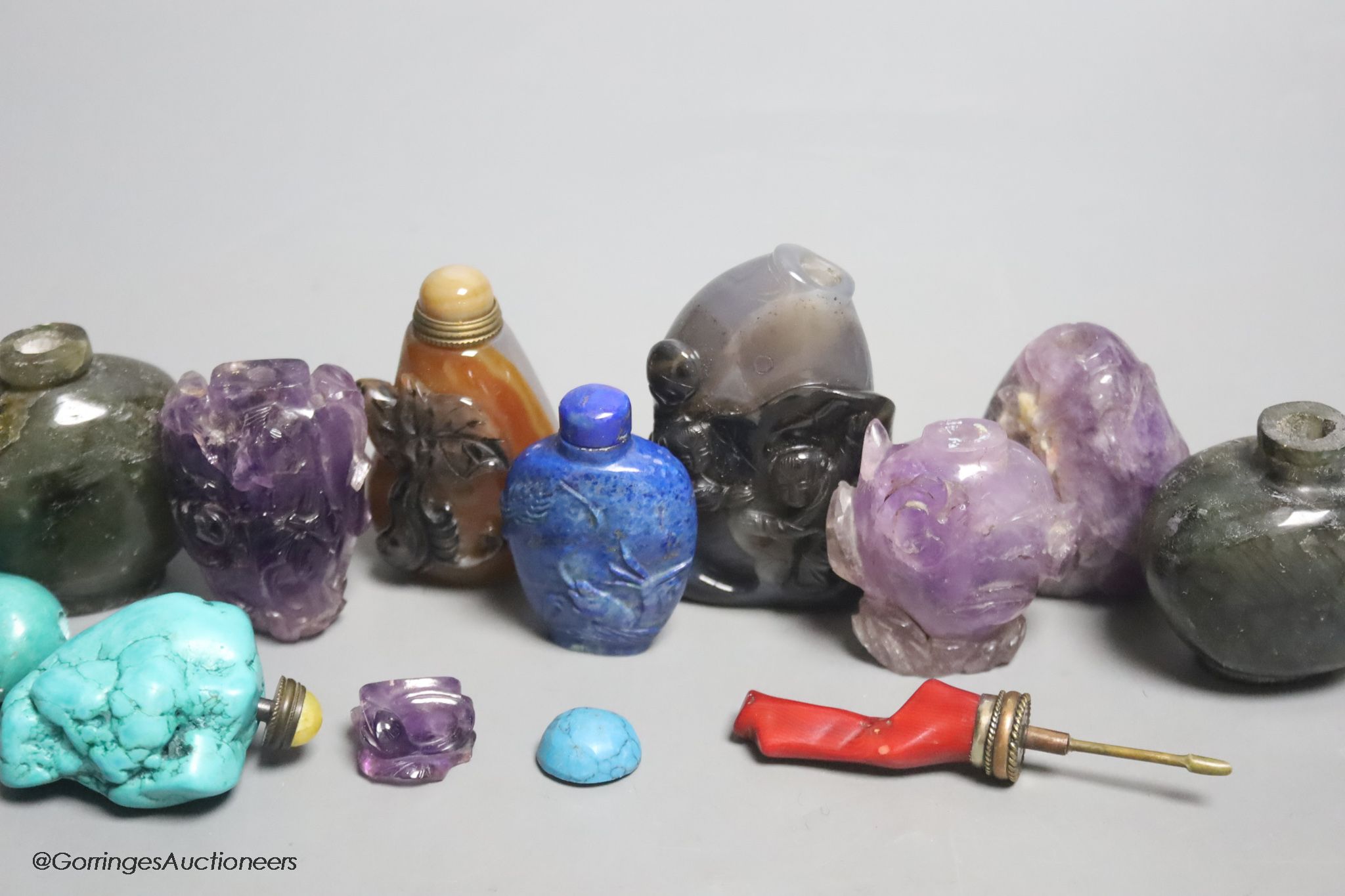 A collection of ten Chinese amethyst, lapis lazuli, turquoise and other hardstone snuff bottles